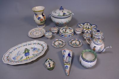 many different pieces of pottery sitting on a table