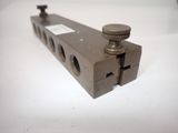 a close up of a metal object on a white surface