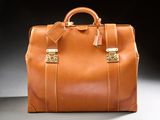 a brown leather bag sitting on a table