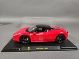 red ferrari sports car on display in a glass case