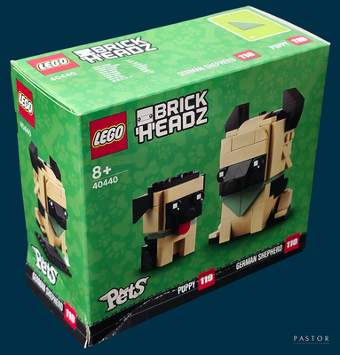 une boîte de figurines Lego Headz avec un chien dessus