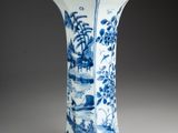 blue and white porcelain vase with a landscape scene on it