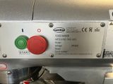 a close up of a machine with a red and green button