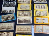 several old postcards of different types and sizes are on a table