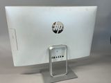 a computer monitor sitting on top of a desk
