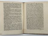 an open book on a table with a white background