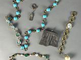 several pieces of jewelry including a necklace, bracelet, and ring