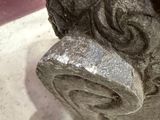 a close up of a stone statue of a dog