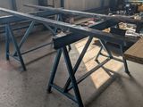 a workbench in a building with a lot of tools on it