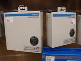 three boxes that are sitting on a shelf in a store