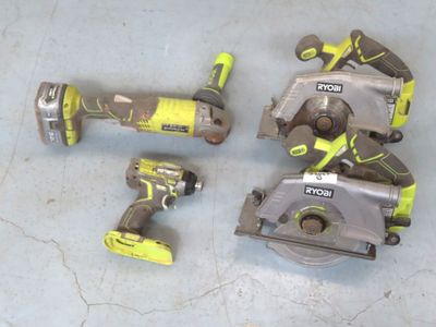 three corded circular saws and two circular circular saws on a table