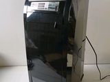 a small black and silver air conditioner sitting on a counter