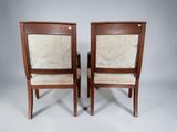 pair of chairs with upholstered back and upholstered arms