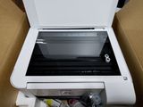 a printer sitting inside of a box with its lid open