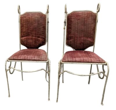 pair of vintage chairs with red upholstered cushions