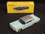a toy car that is sitting next to a box