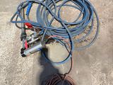 a hose that is sitting on the ground next to a hose