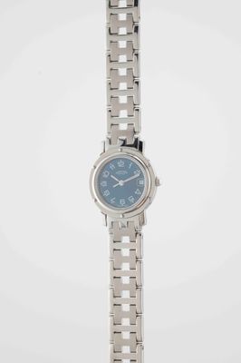 a close up of a wrist watch with a blue face