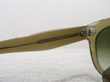 a pair of sunglasses sitting on a white surface