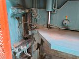 an image of a machine that is working on a piece of metal
