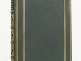 an old green book with gold trim and a gold border