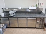 a kitchen with stainless steel appliances and granite counter tops