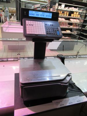 an image of a cash register in a grocery store