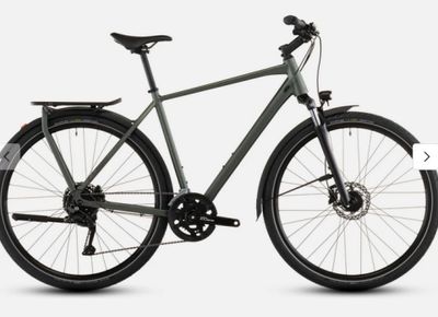a bike that is parked on a white surface