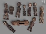 an image of a group of wooden figurines sitting on top of a table