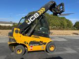 a yellow forklift truck parked in a parking lot