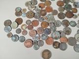 a lot of coins that are on the table