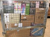 a metal cart with many boxes on it in a warehouse