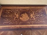 a wooden table with a decorative design on it