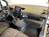 the interior of a car with a steering wheel, dashboard, and dashboard controls