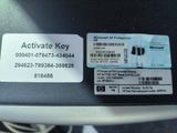 a close up of a car ' s driver ' s license and key