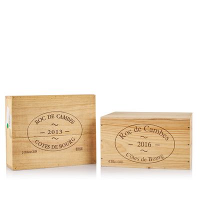 a couple of wooden boxes sitting next to each other on a white surface