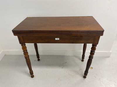 a small wooden table with a drawer on top of it