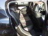 a car that has the door open and the seats down