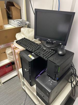 a computer on a desk with a keyboard and a monitor