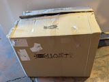 a box that is sitting on the floor next to a wall