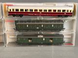 three train cars that are sitting in a clear box