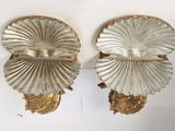 pair of gold scallop wall sconces on a white background