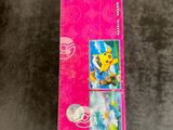 a pink box of toothbrushes on a table