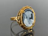 an image of a gold ring with a carved cameo of a woman