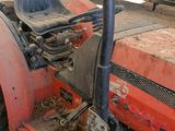 a tractor that is sitting in the dirt