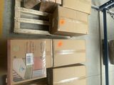 many boxes stacked on top of each other in a warehouse