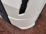 a close up of a white truck with a black door handle