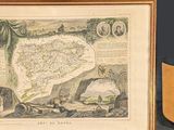 a framed picture of a map and a coat of arms