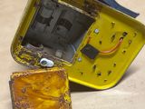 a small yellow box with a small square inside of it