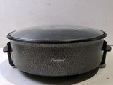 a close up of a crock pot sitting on a table